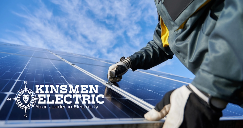 an electrical expert carefully places a solar panel on top of a roof