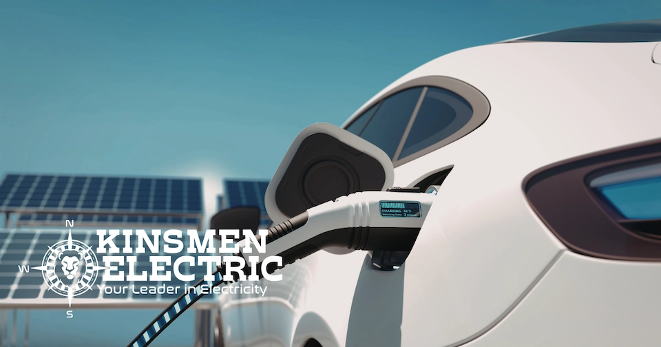 an electric vehicle charges with an image of solar panels on a roof sits in the background